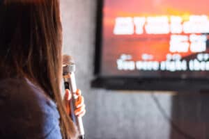 Woman Singing At The Karaoke Bar