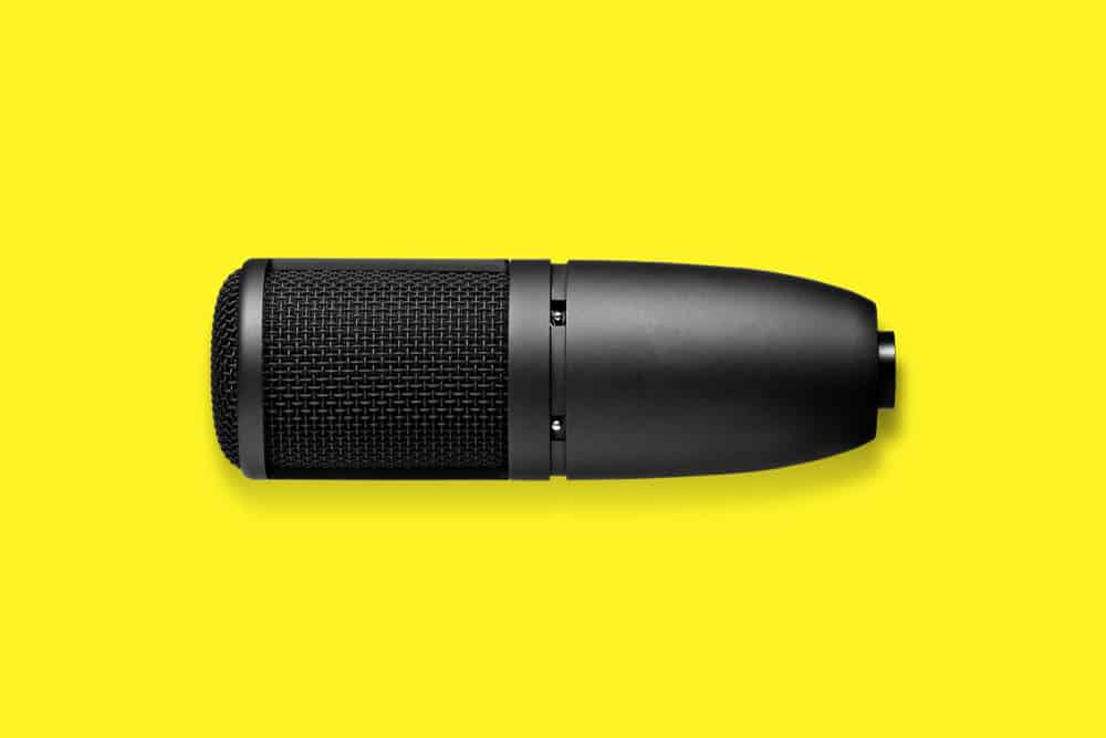 Microphone against yellow background