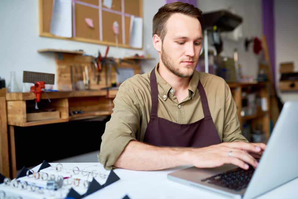 Portrait Of Young Man Using A Laptop